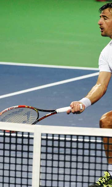 Isner again gets bounced in first round, this time north of the border